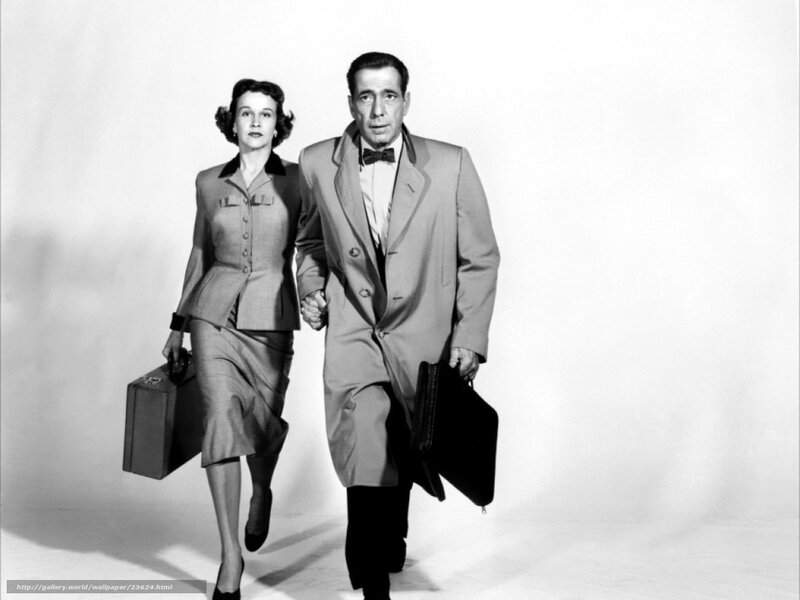 Man and woman walking with briefcases