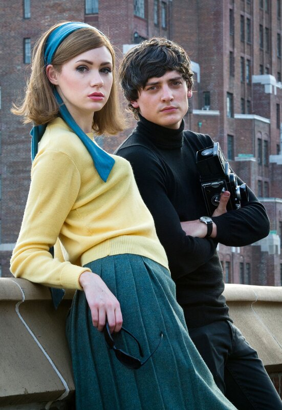 Man and woman with camera on rooftop