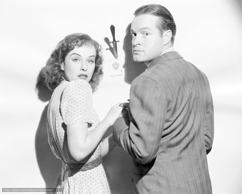 Man and woman with knife in wall
