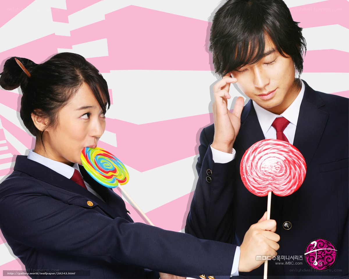 Man and woman with lollipops