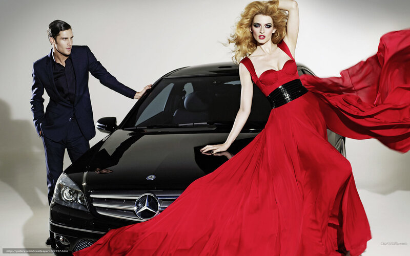 Man and woman with luxury car