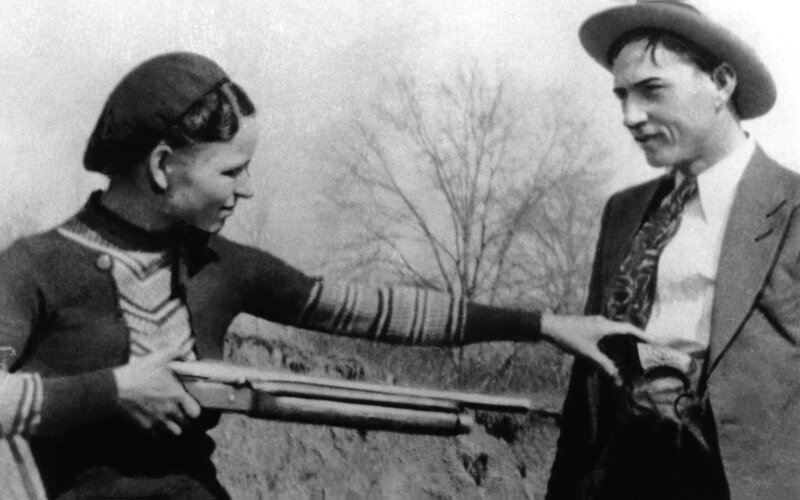 Man and woman with shotgun