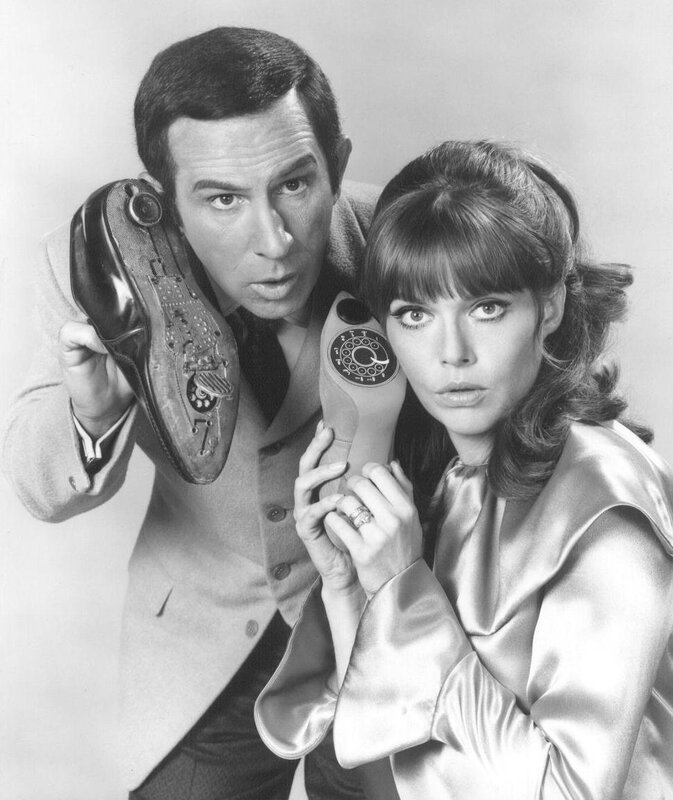 Man and woman with spy gadgets