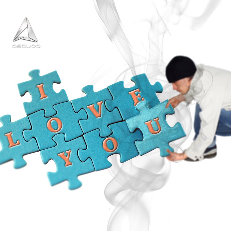 man assembling puzzle with love message