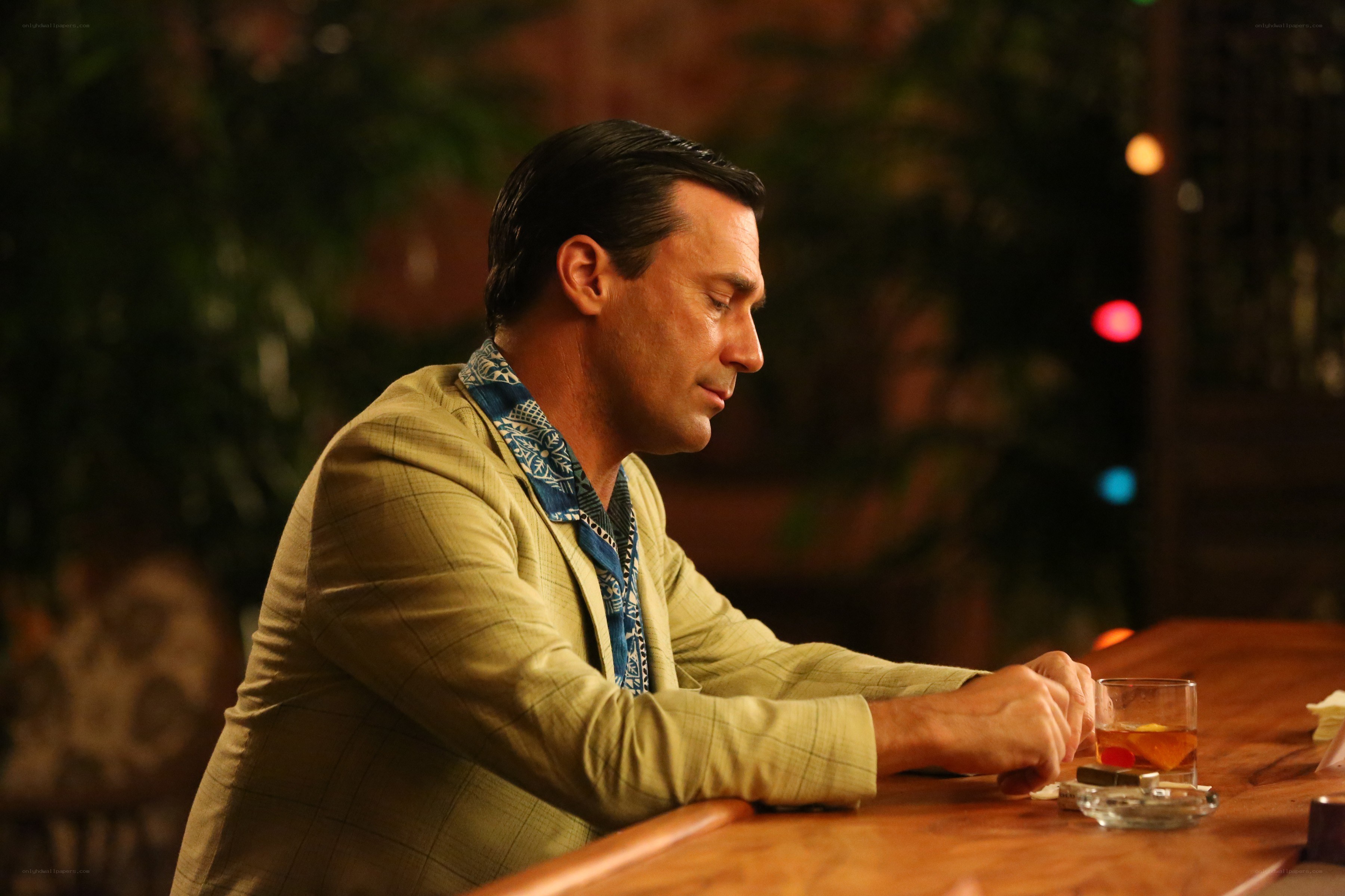 man at a bar with drink