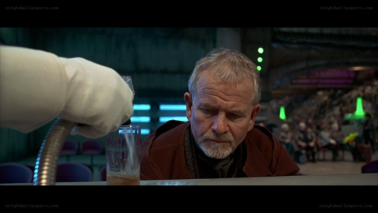 man at a bar with drink