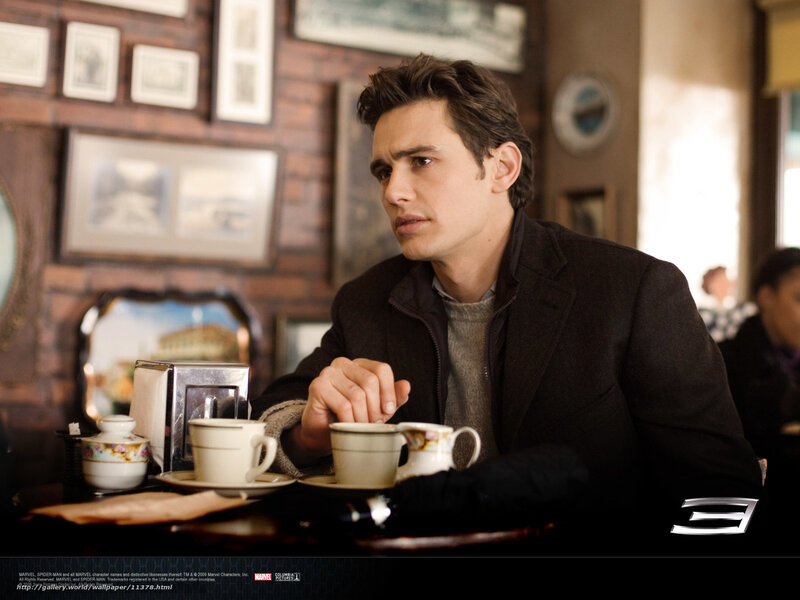 man at a cafe table
