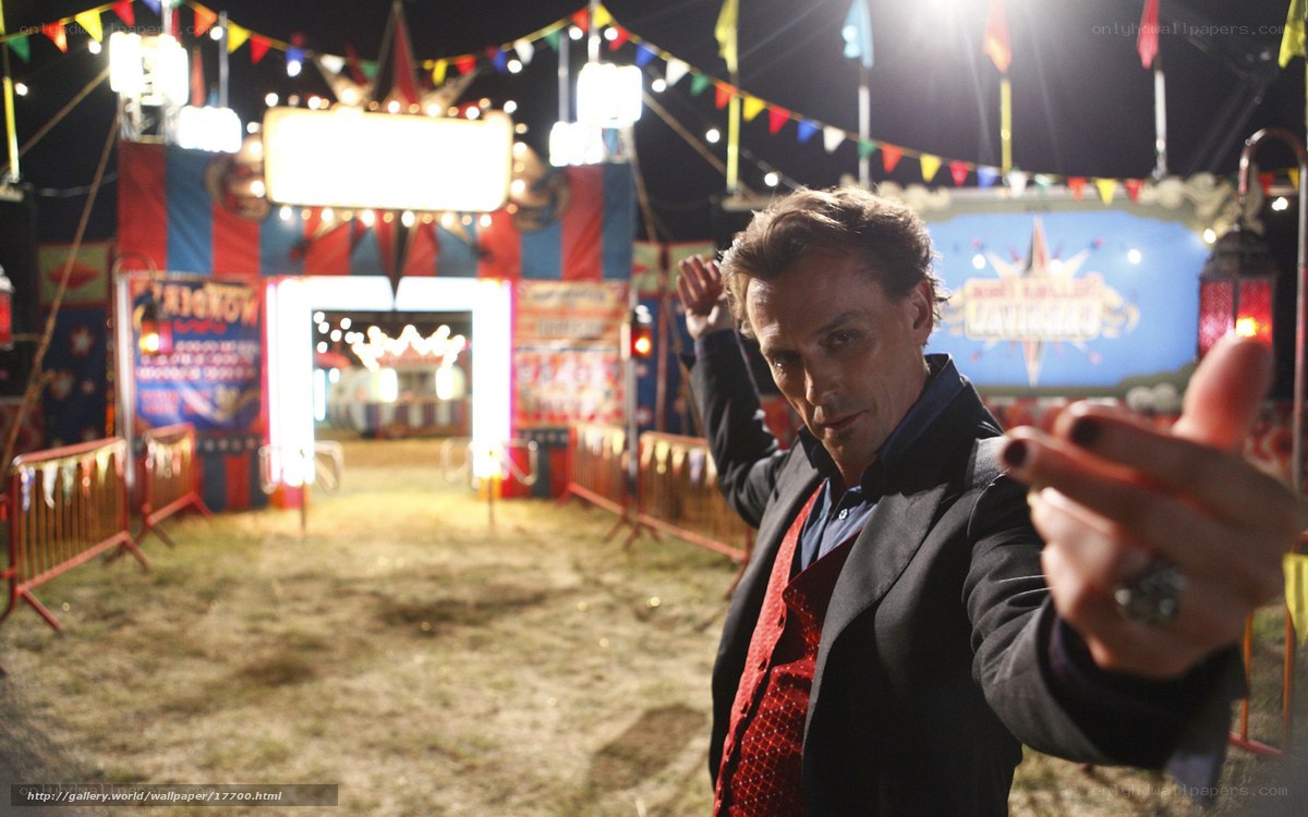 Man at a carnival at night