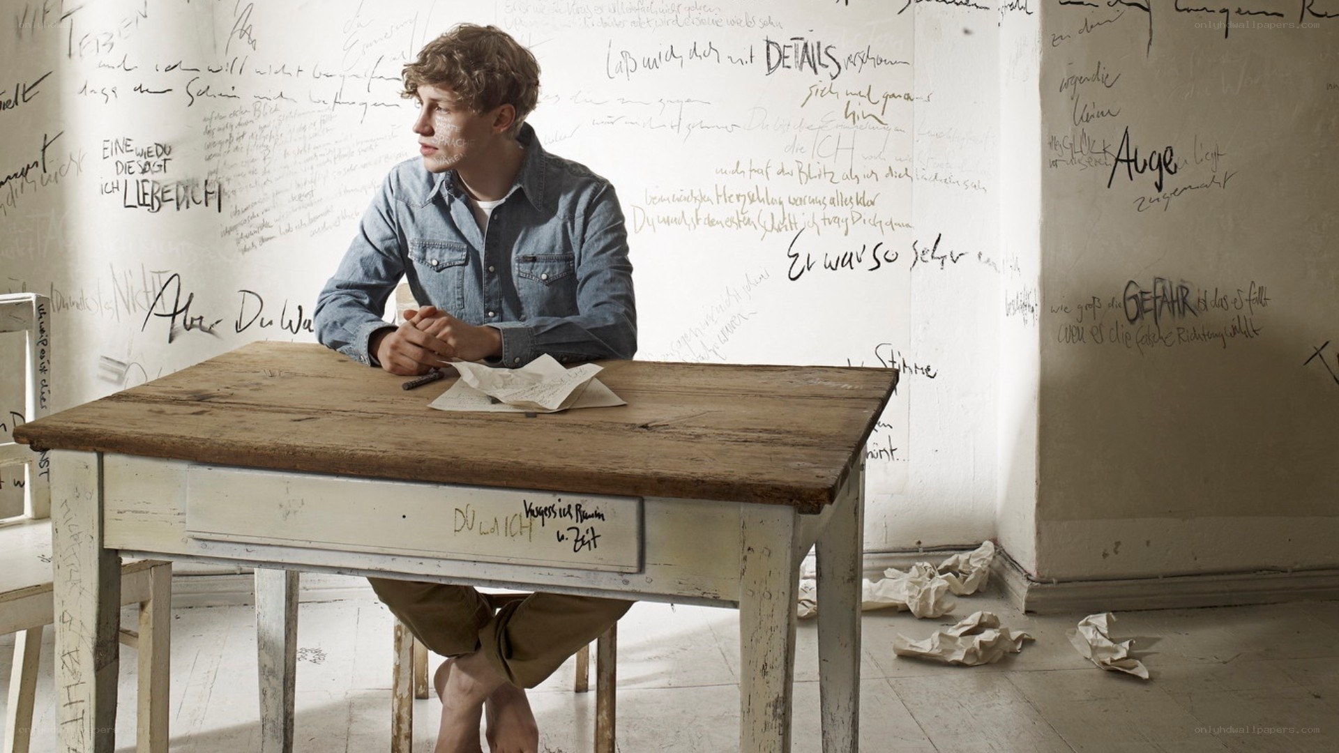 Man at a desk with handwritten notes