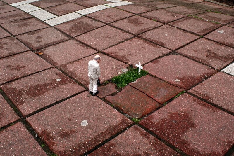 Man at a grave marker