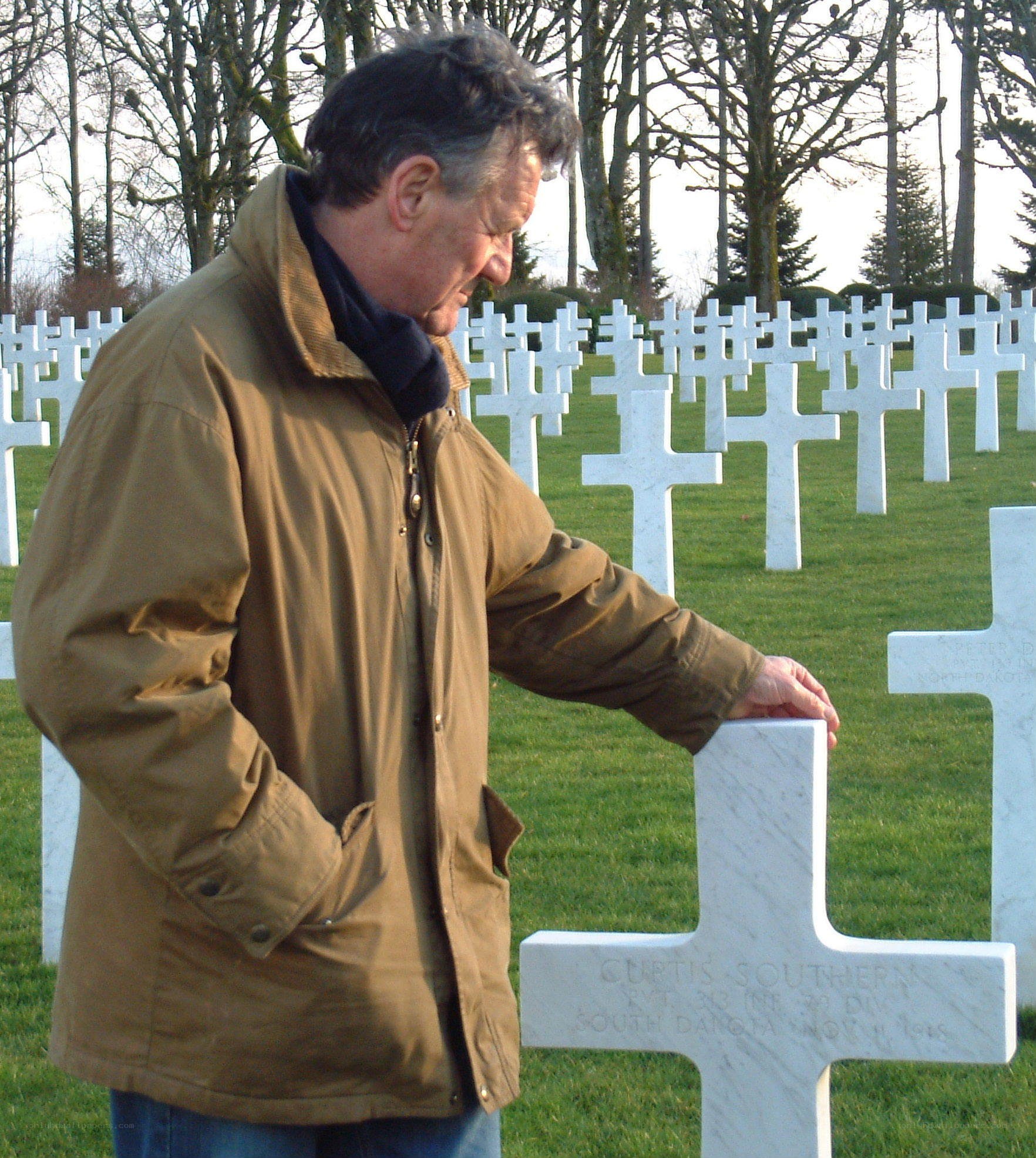Man at a war cemetery