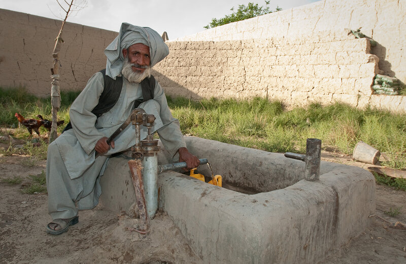 Man at a water pump