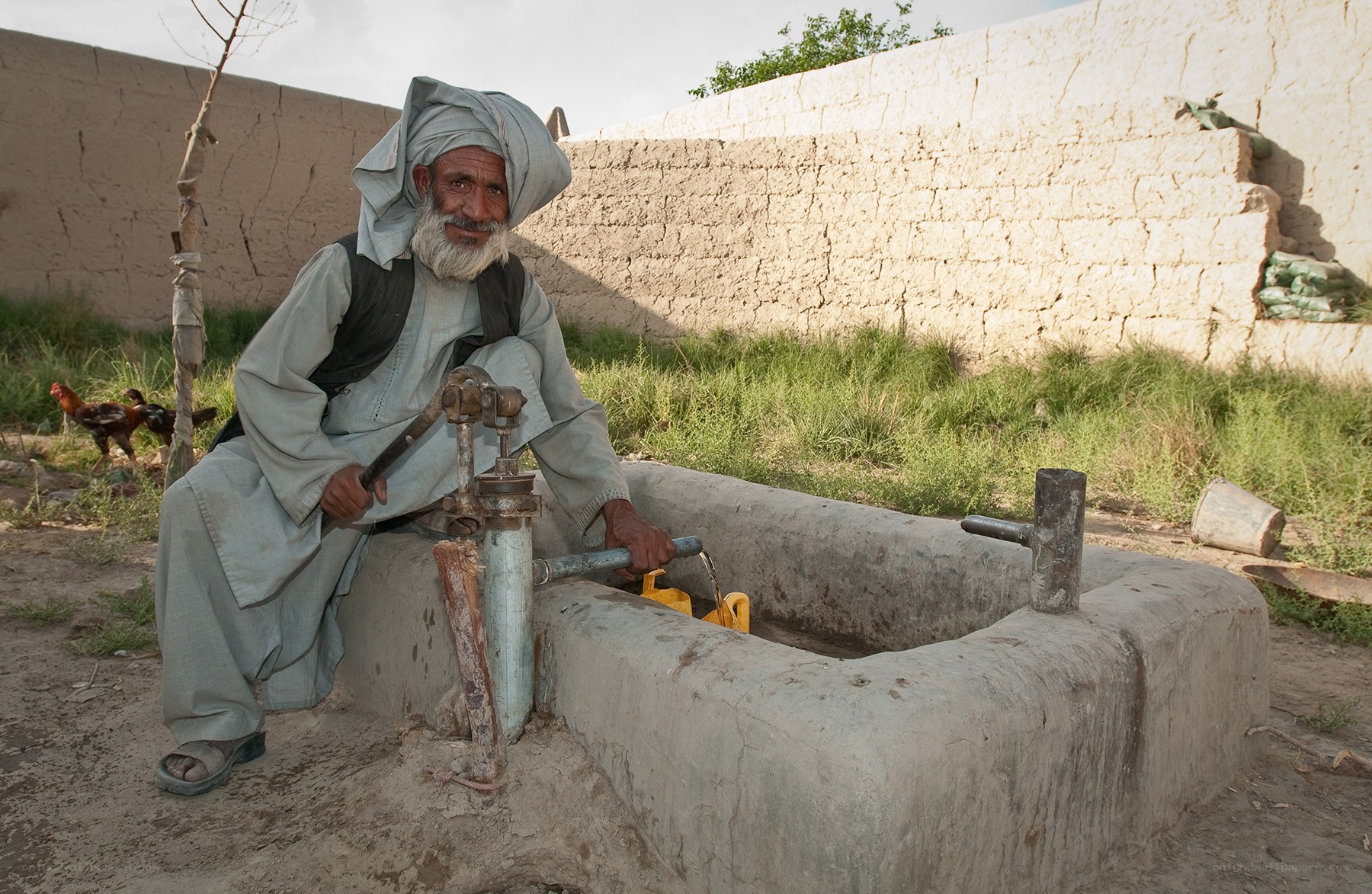 Man at a water pump