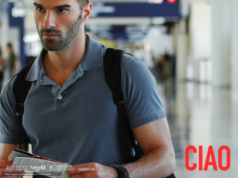 man at airport holding brochure
