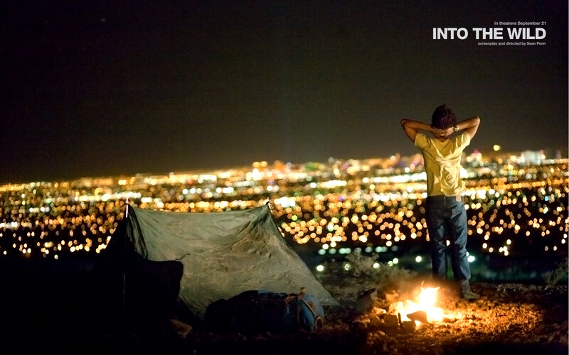 Man at campsite overlooking city