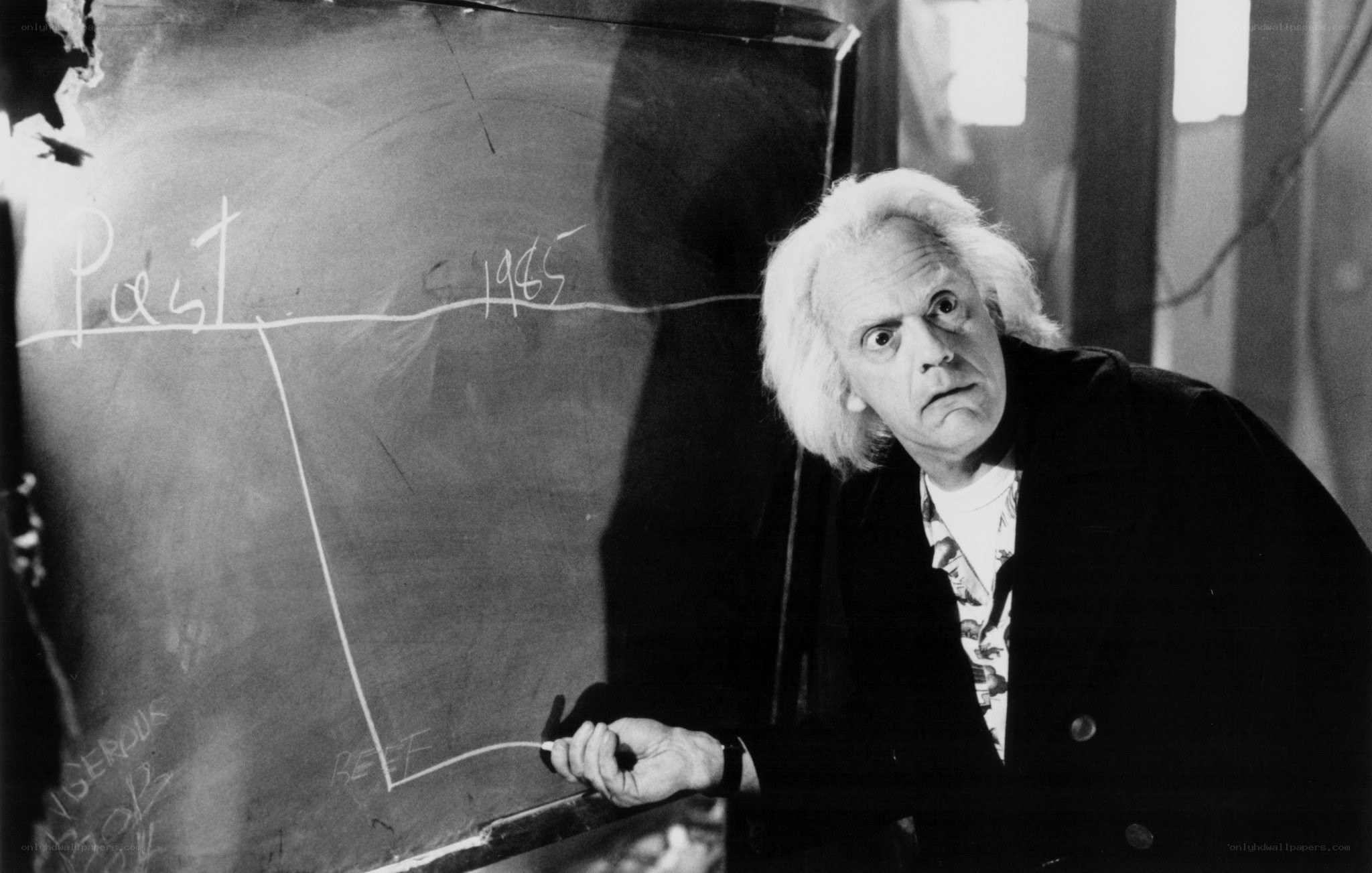 man at chalkboard with diagram