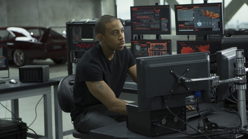 man at computer in garage