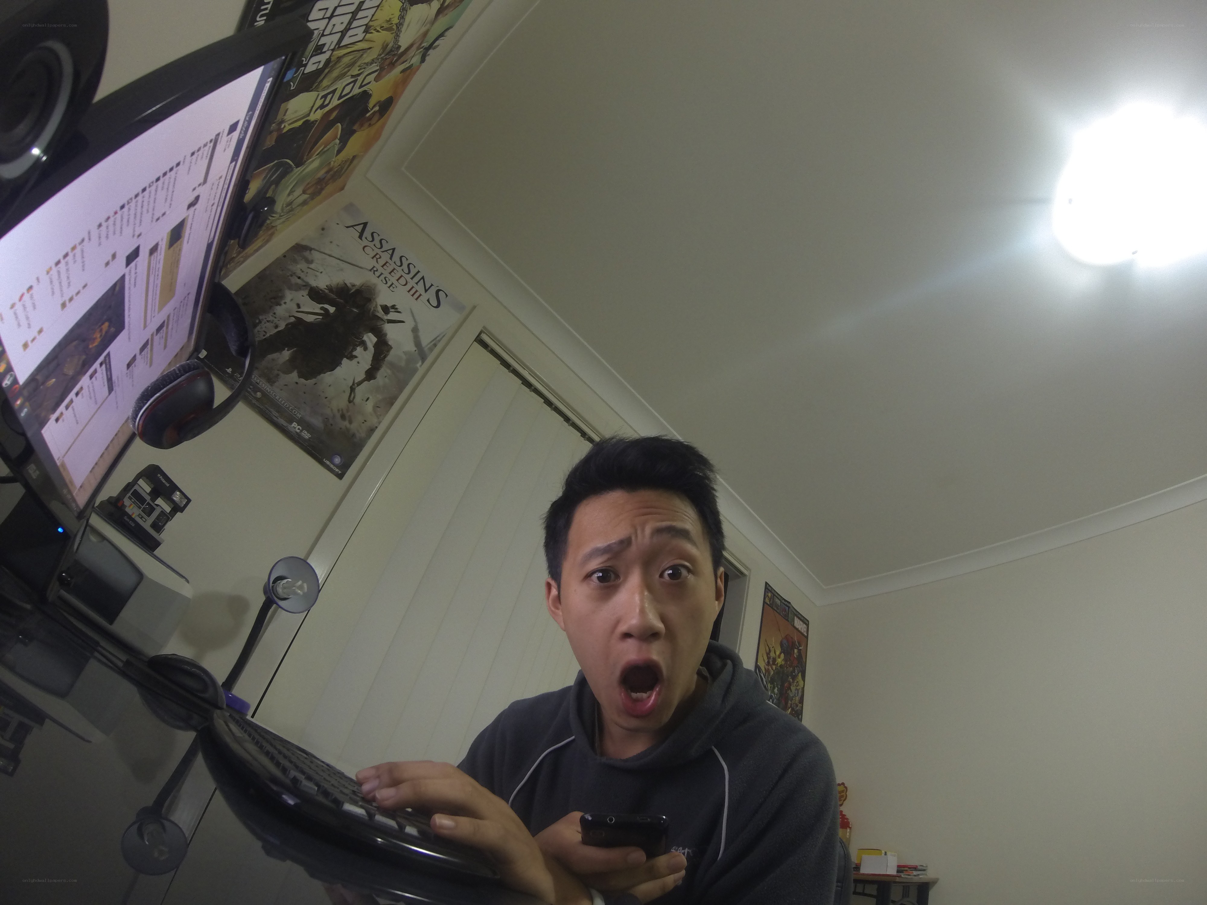 man at computer with surprised face