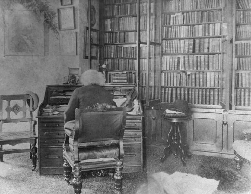 Man at Desk in Library