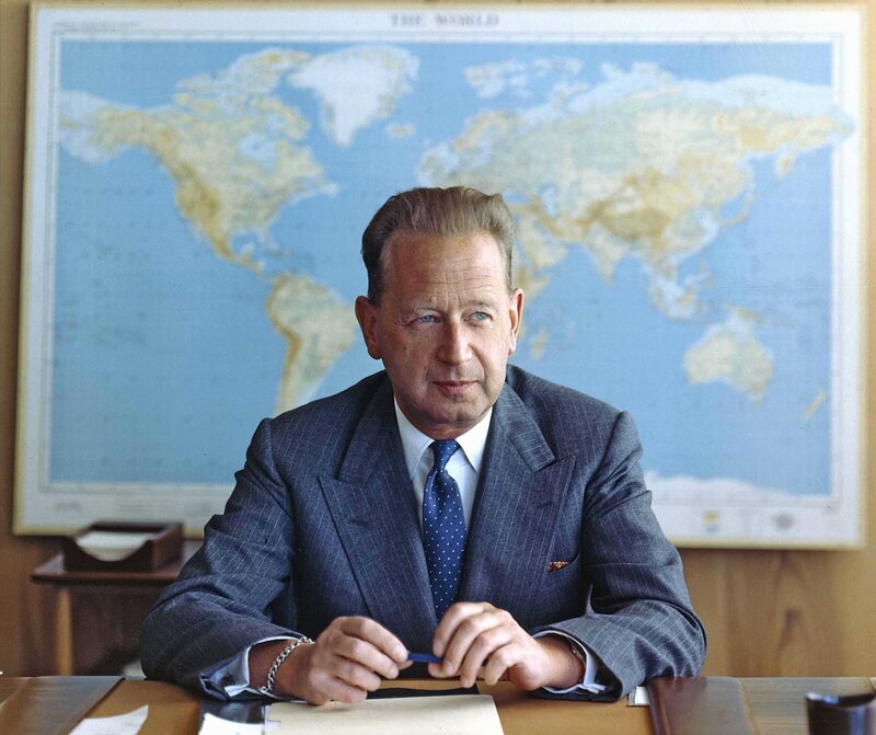 Man at desk with world map