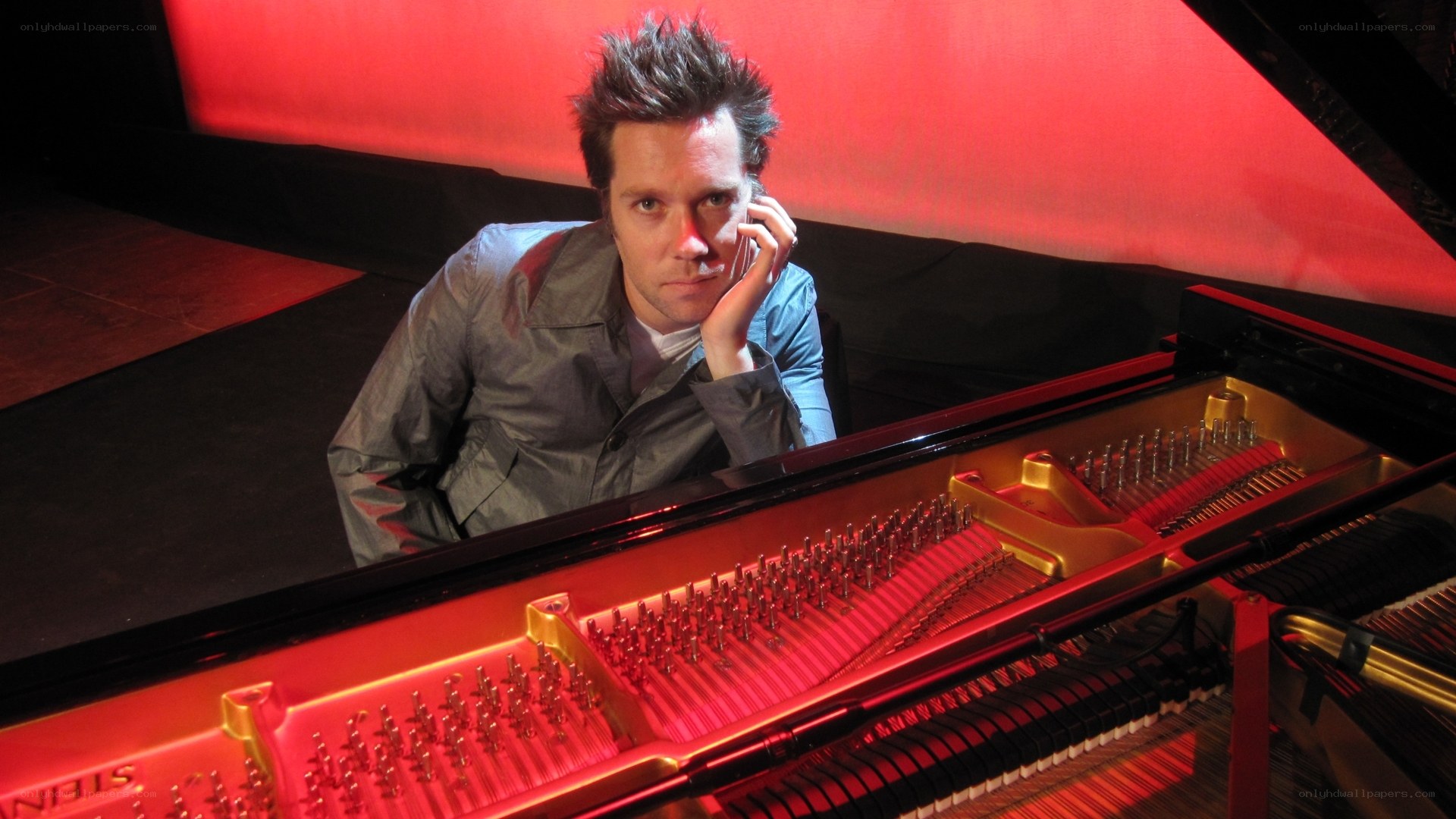 man at grand piano