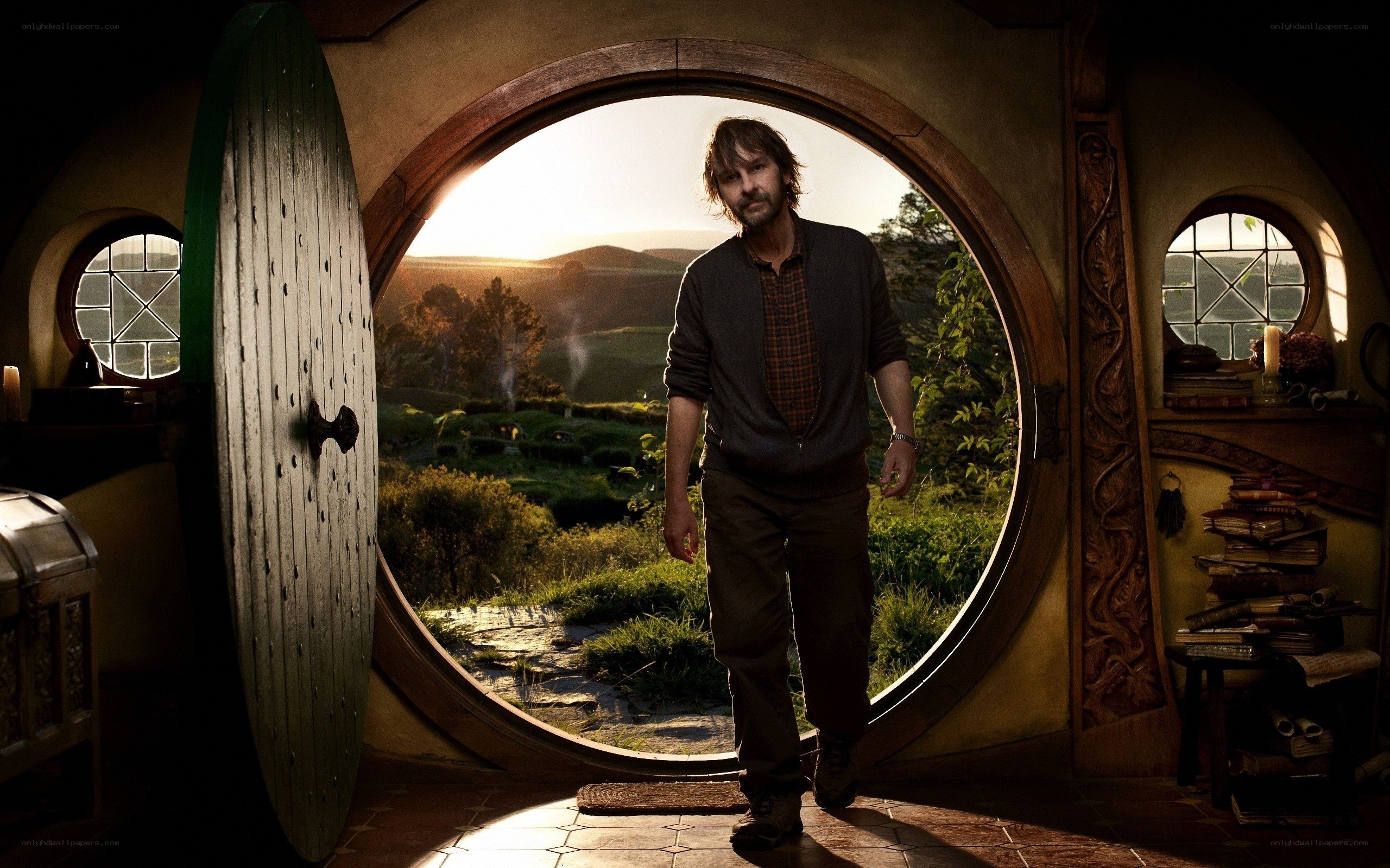 man at hobbit hole door
