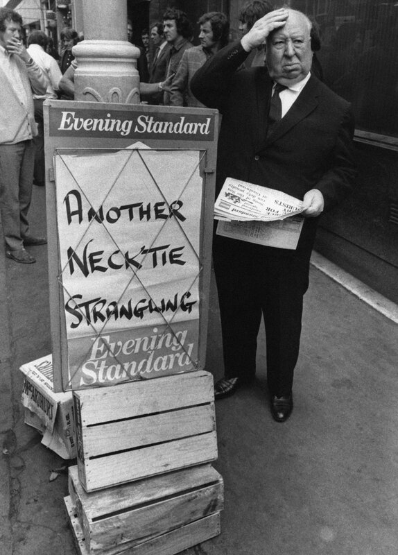 Man at newspaper stand