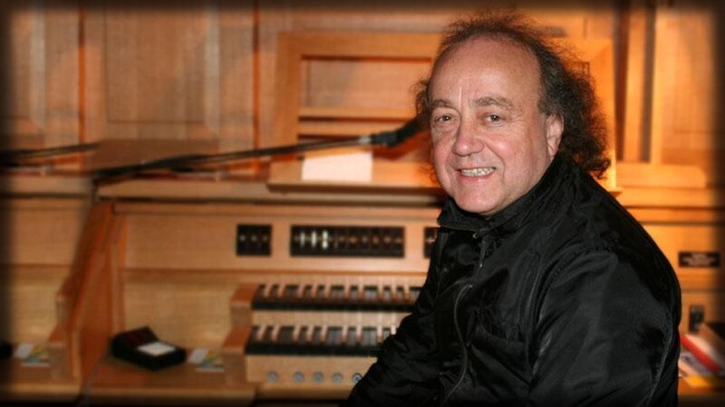 man at organ console