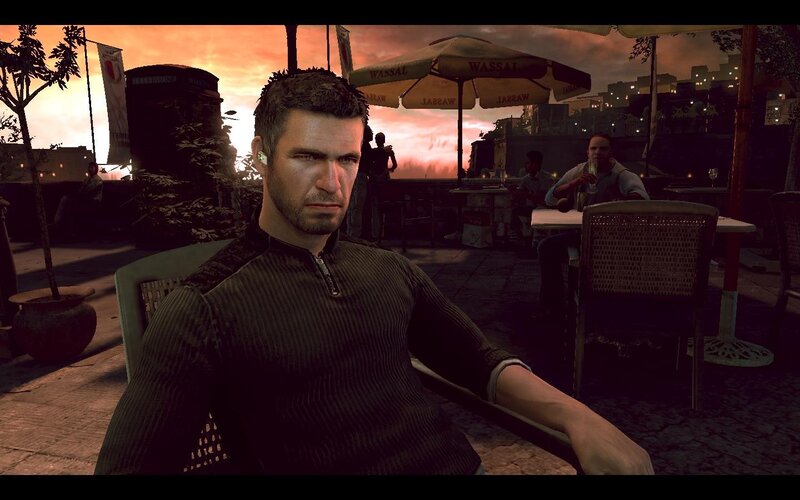 man at outdoor cafe at sunset