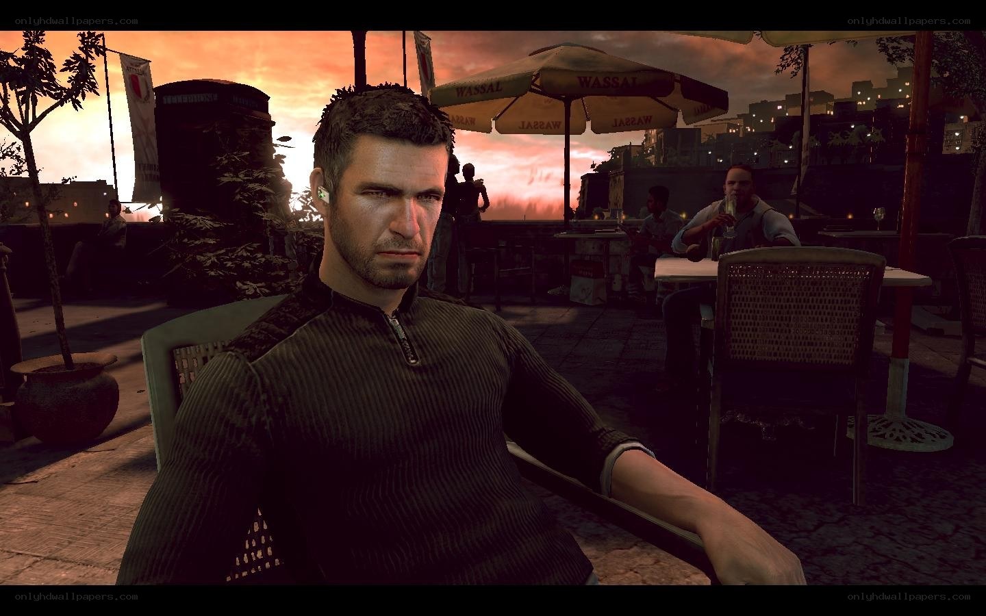 man at outdoor cafe at sunset