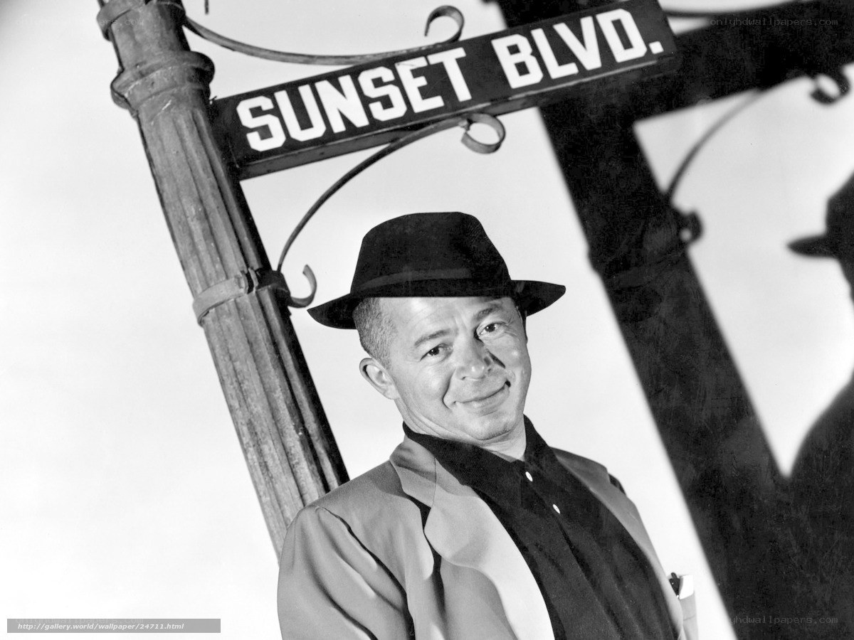 Man at Sunset Blvd sign