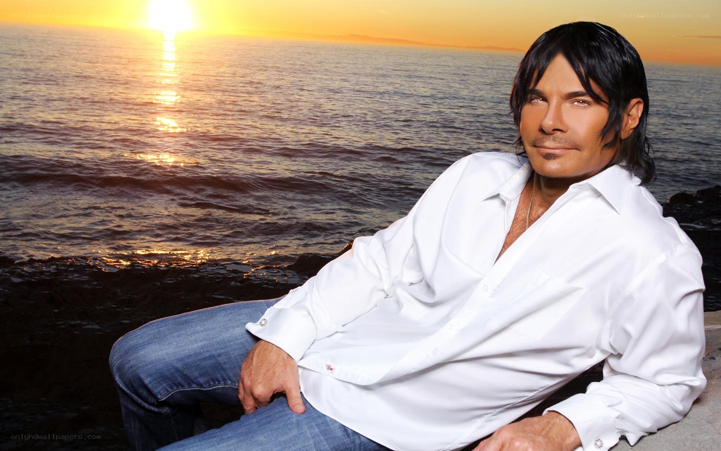 man at sunset by the ocean