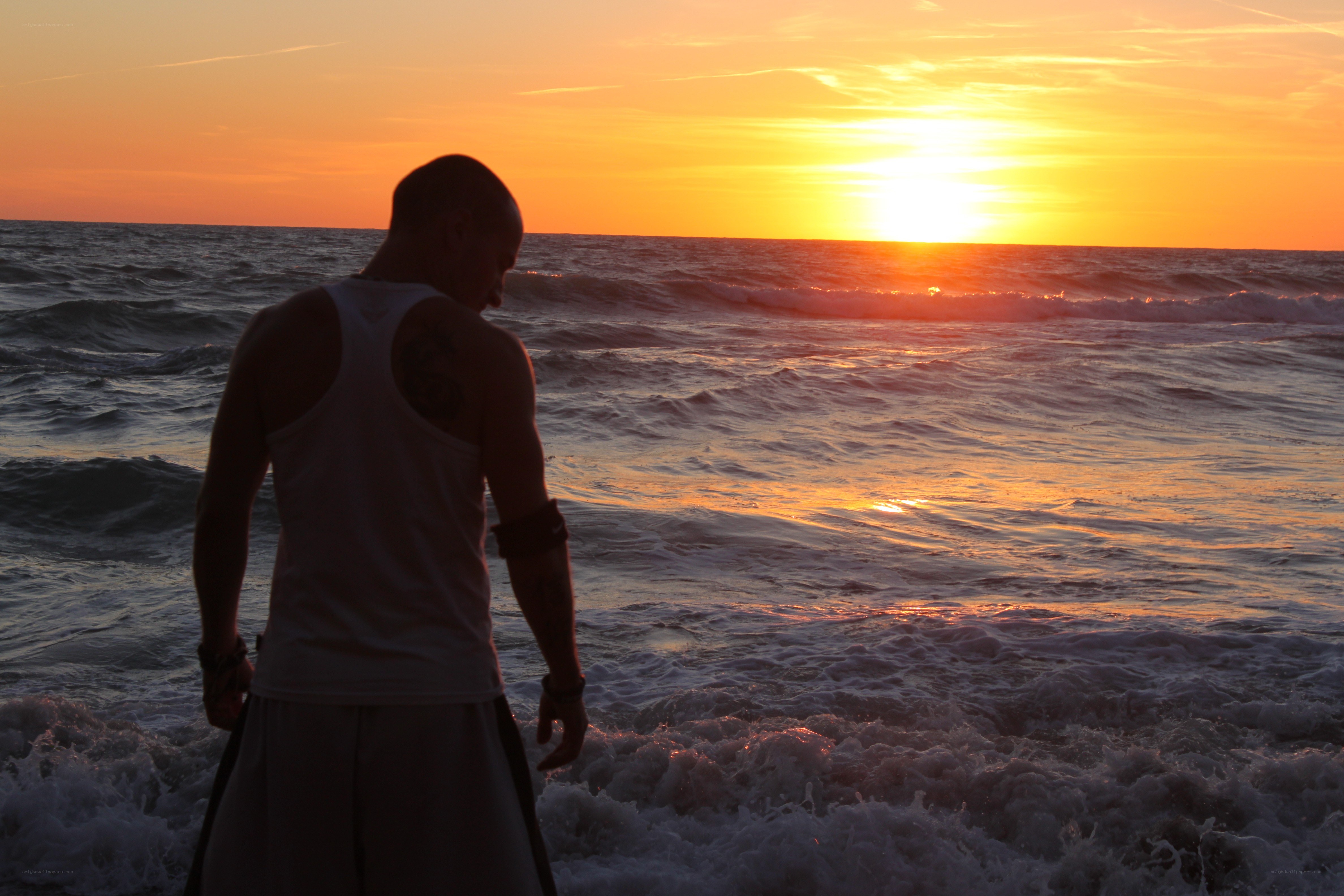 Man at sunset on the beach
