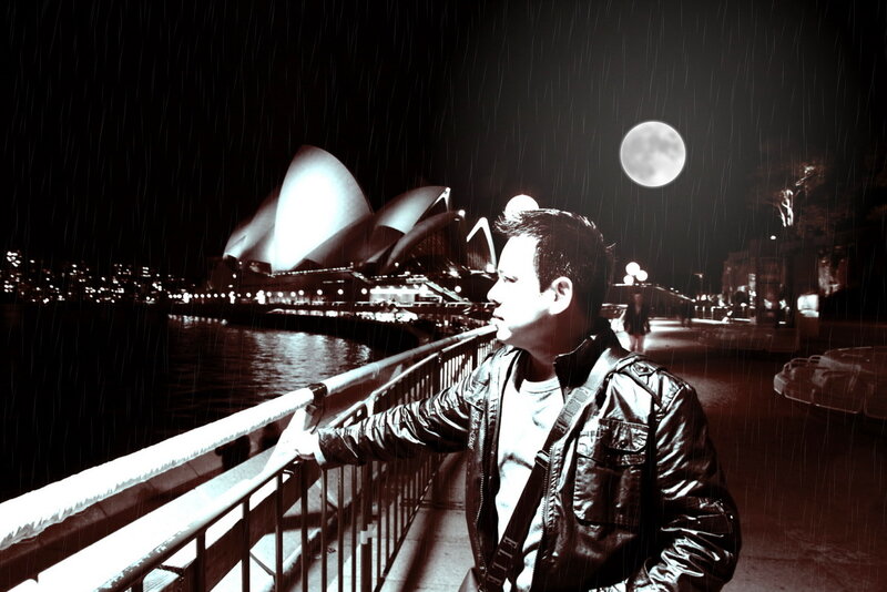 Man at Sydney Opera House in rain