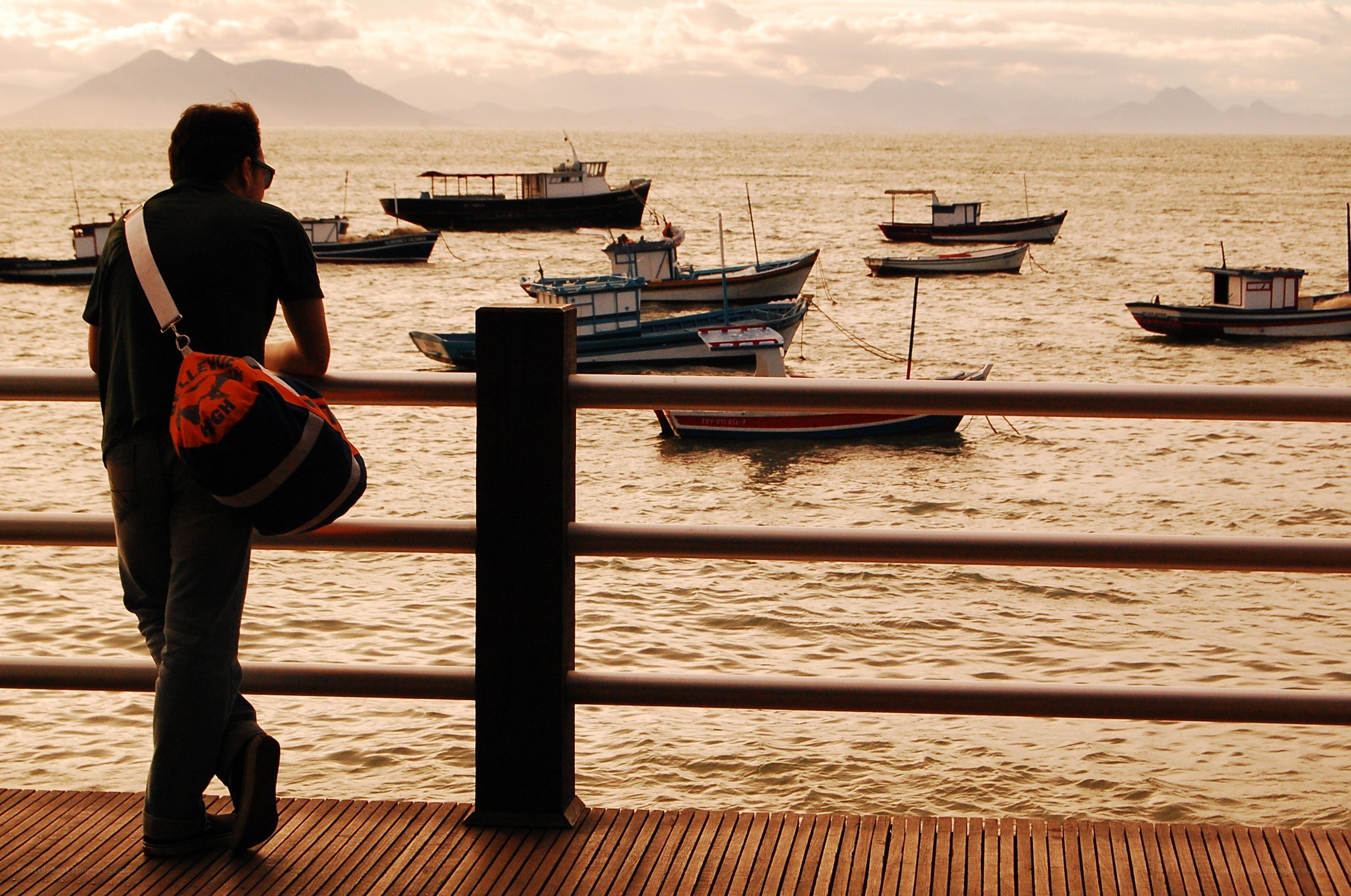 Man at the dock with boats