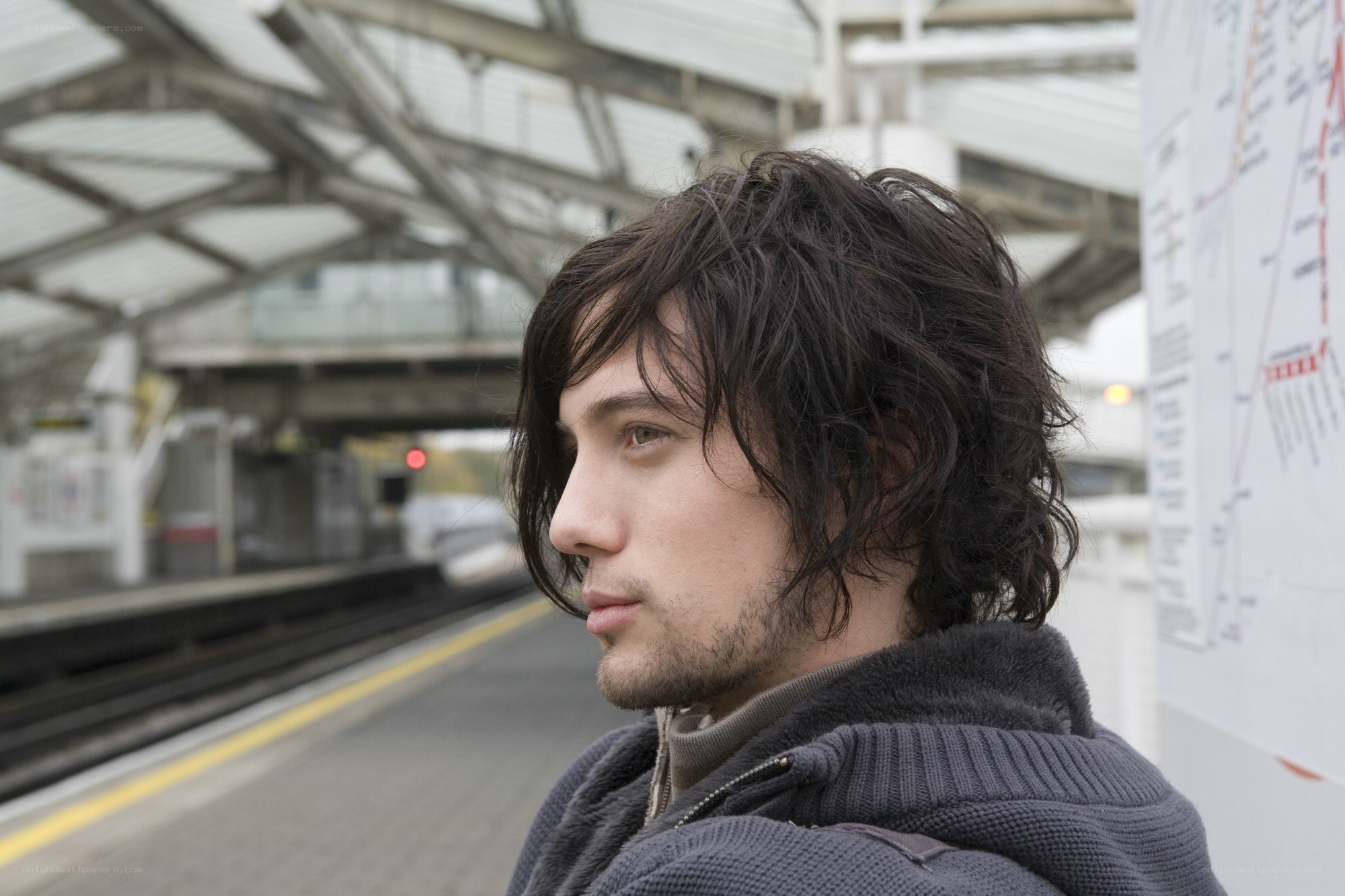 man at train station