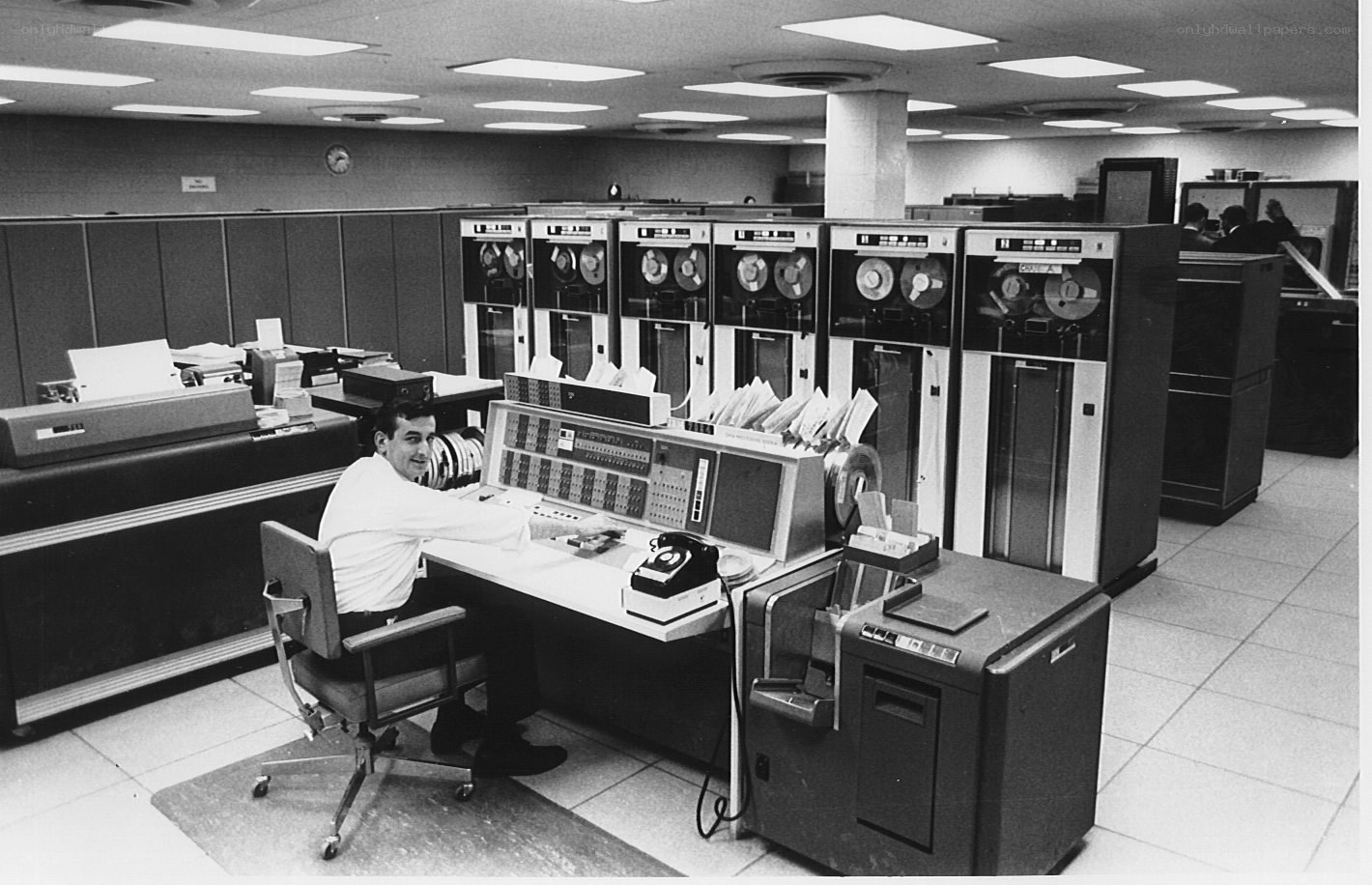 Man at vintage computer console