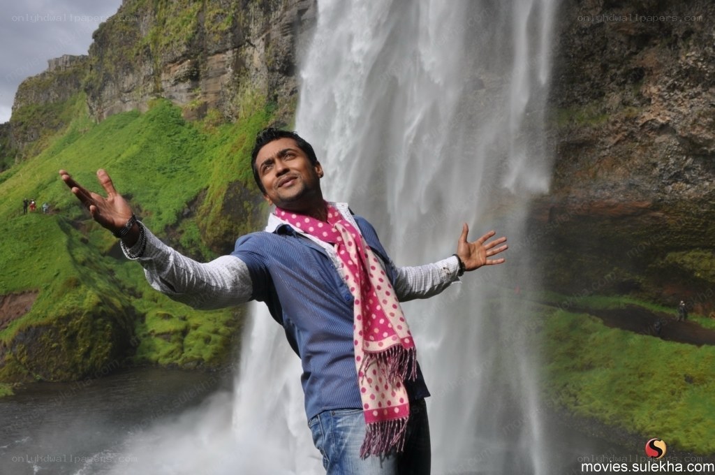 man at waterfall with scarf