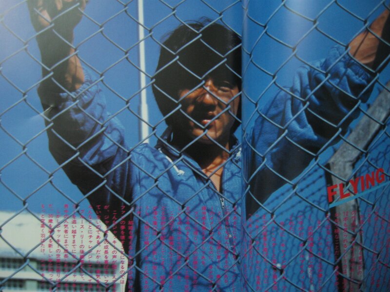 Man behind a chain-link fence
