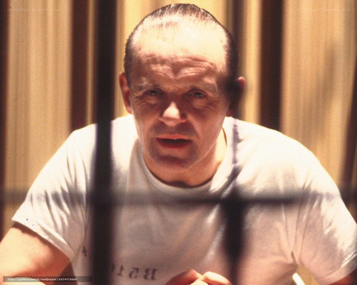man behind bars in white shirt