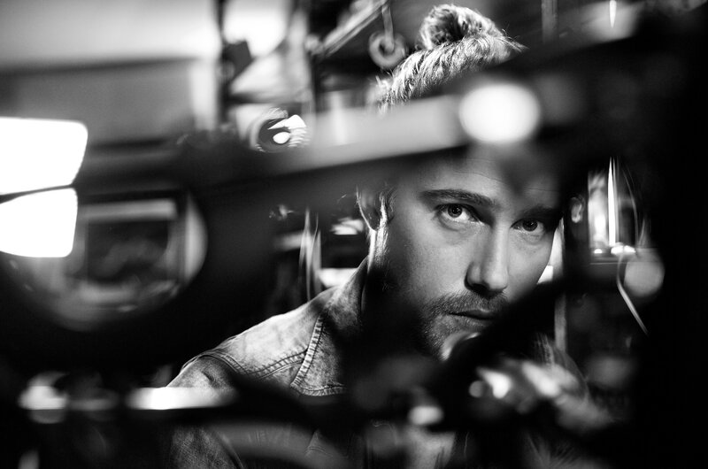 man behind camera equipment
