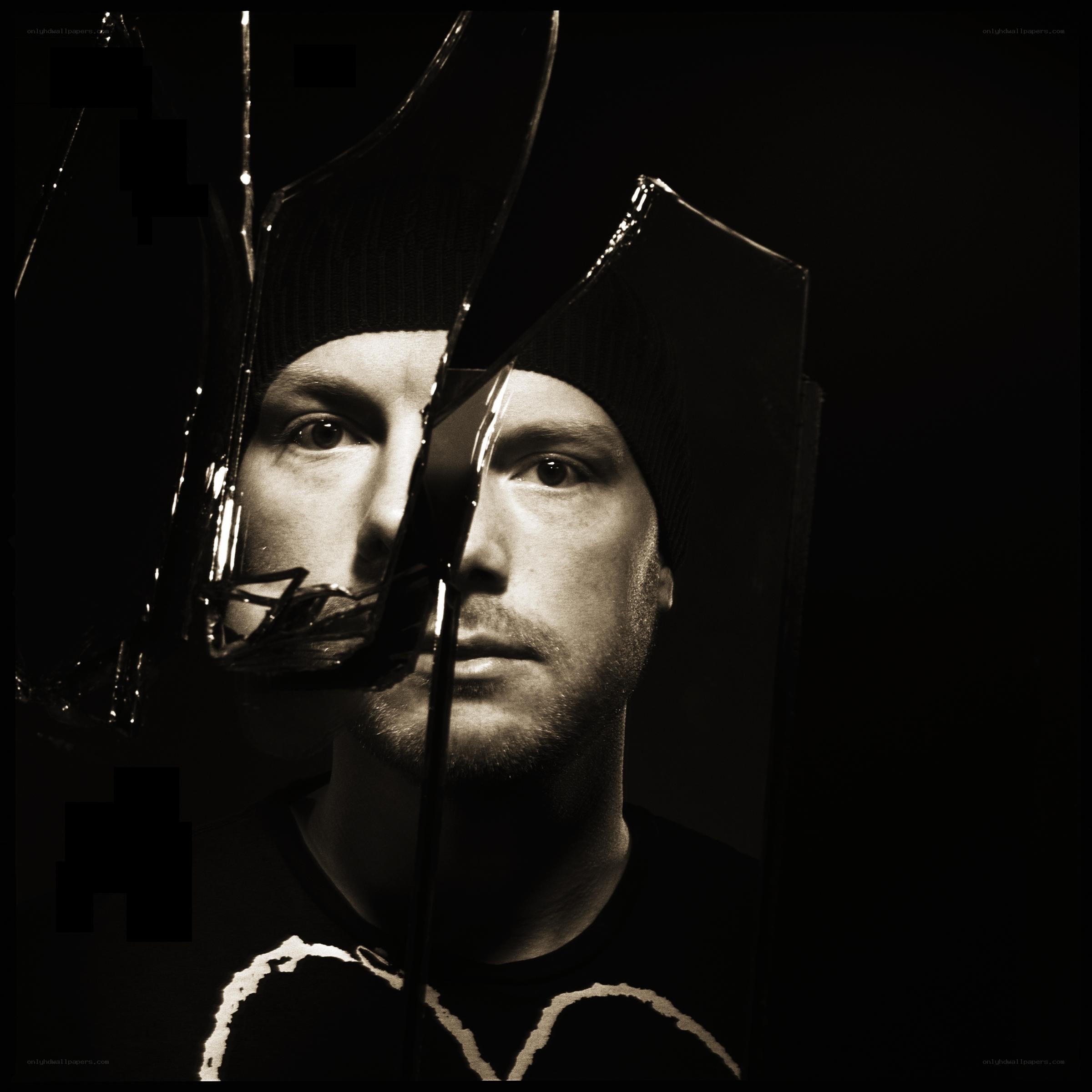 man behind shattered glass
