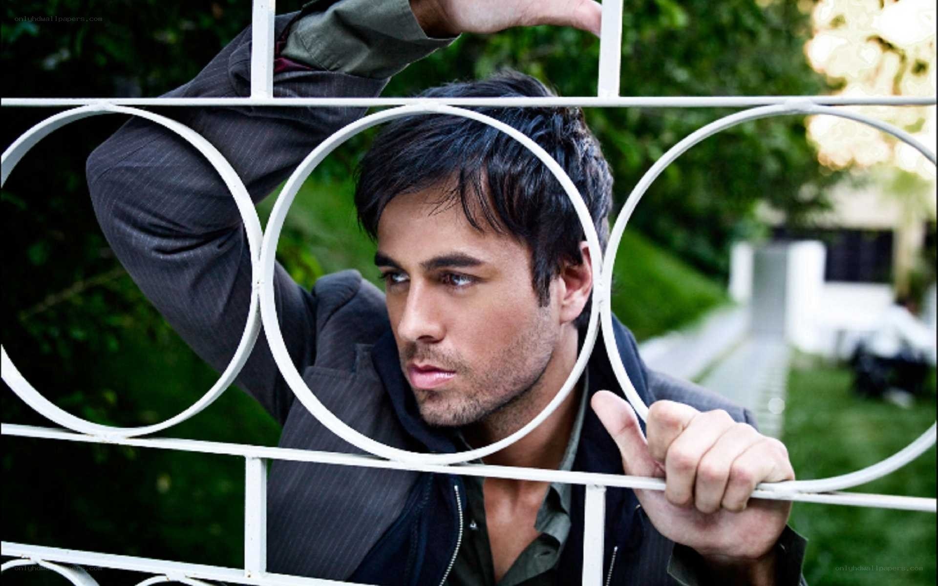 man behind white railing