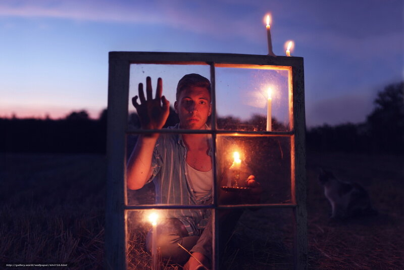 Man behind window at dusk