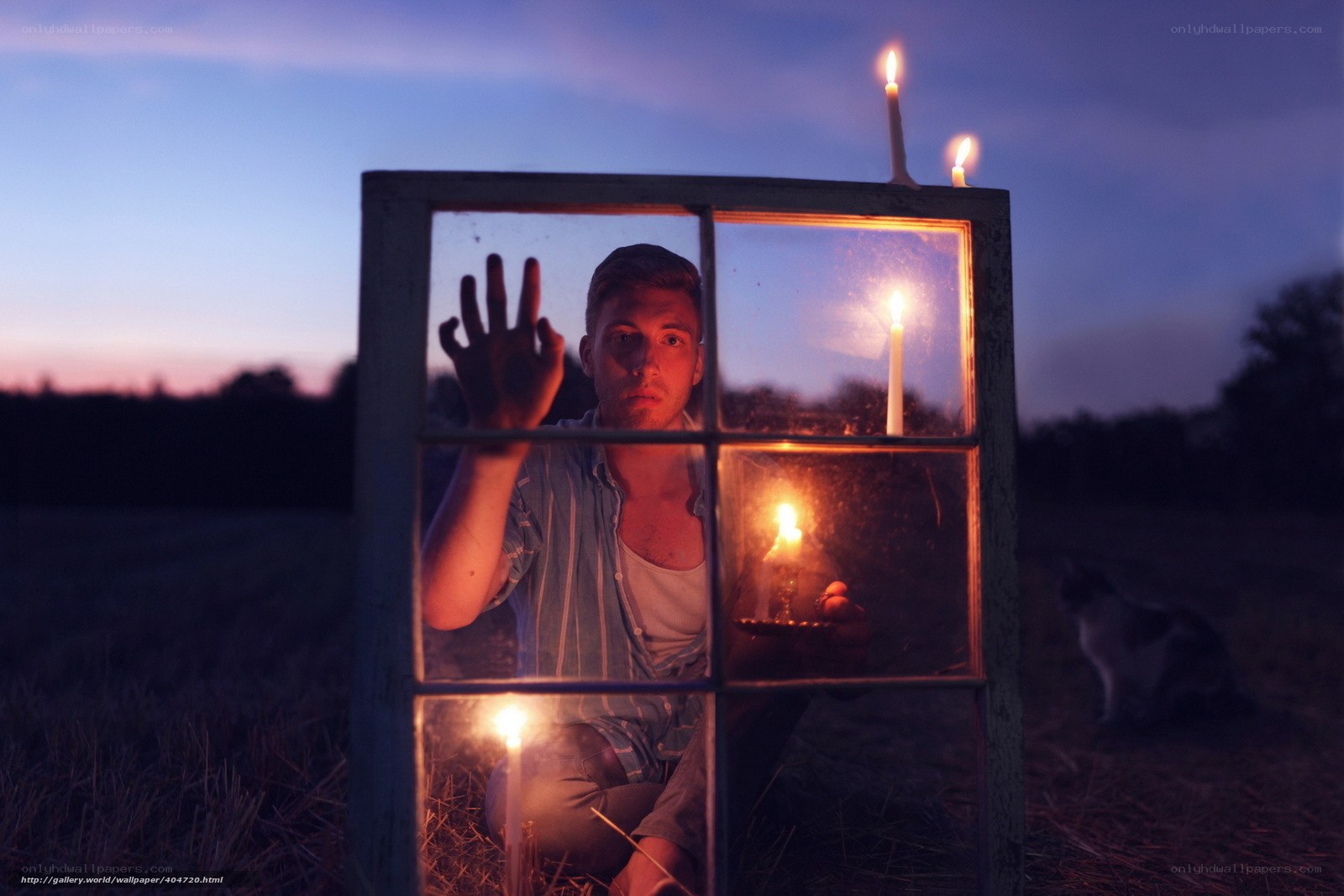 Man behind window at dusk