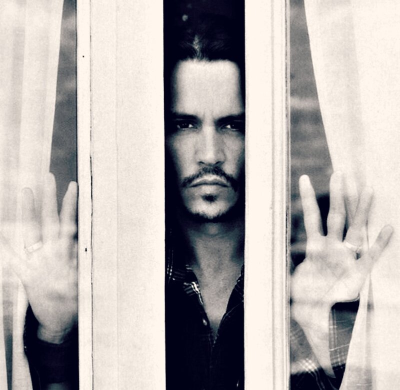 Man Behind Window Bars