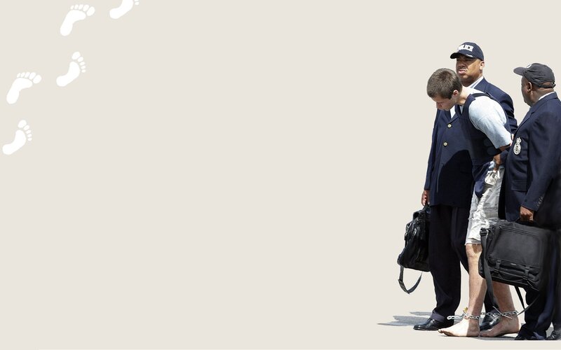 Man being escorted by police