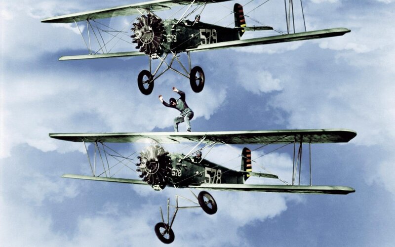 Man Between Two Airplanes