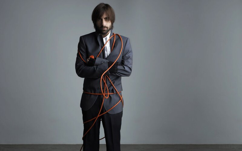 Man bound by orange rope