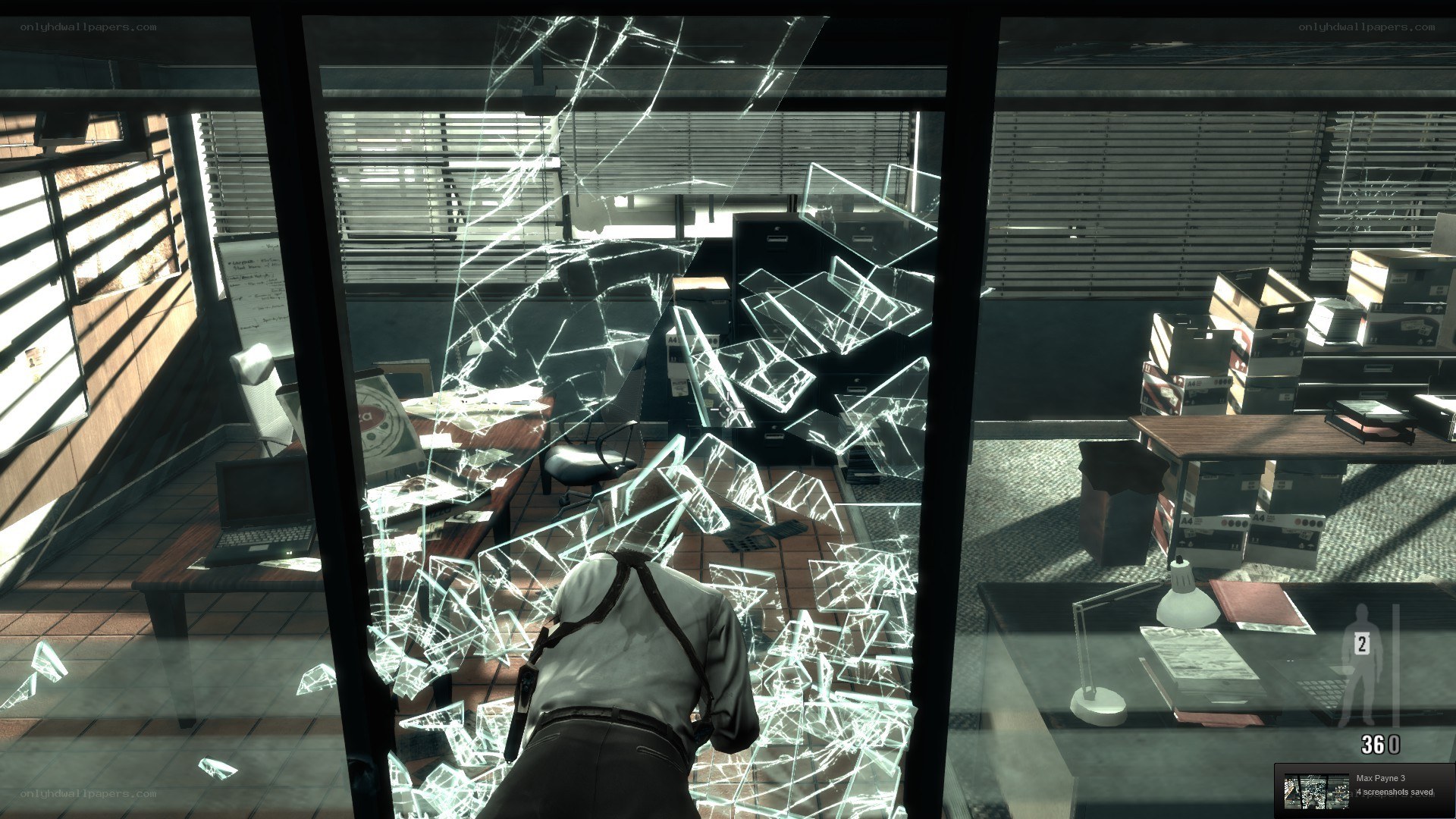 Man breaking glass in office